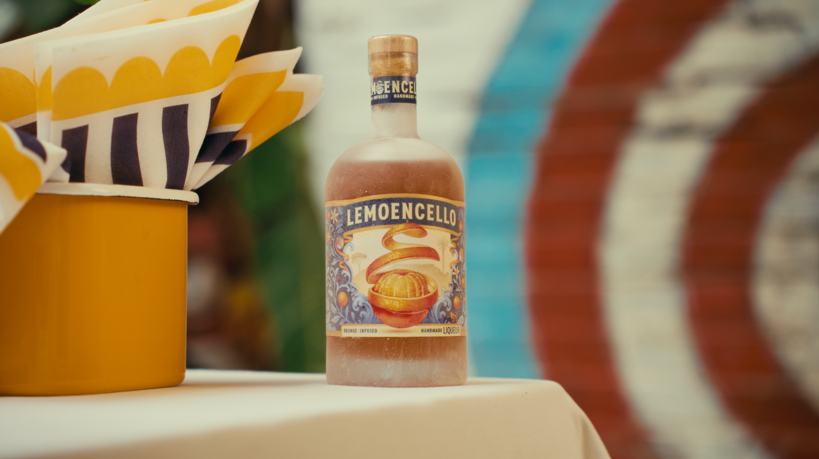 LEMOENCELLO BOTTLE against a target backdrop